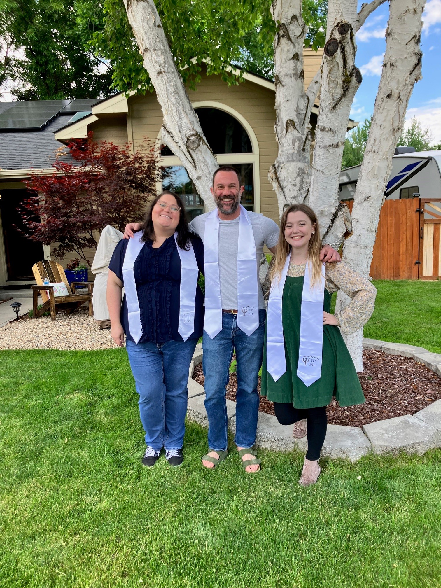 A group of 3 graduates.